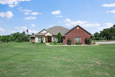 View of front facade with a front lawn and brick siding