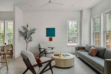 Sitting room with a ceiling fan, baseboards, ligh
