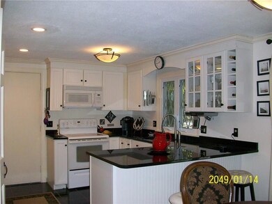 Modern kitchen with tile floors and...