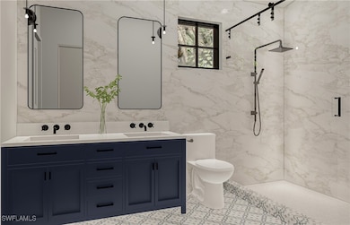 Full bathroom with a sink, toilet, double vanity,