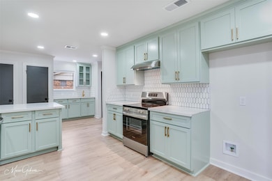 Kitchen featuring light hardwood / wood-style floo