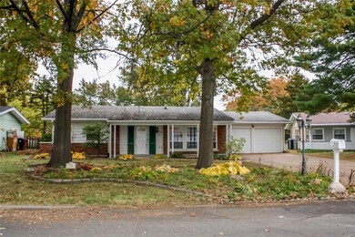 Mature trees and landscaping areas in the front yard