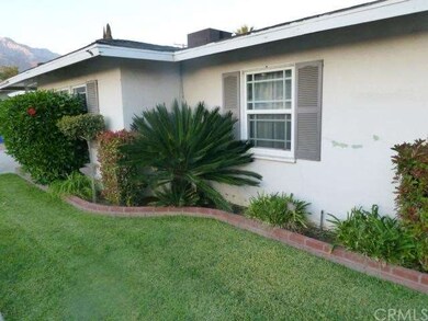 VIEW OF THE SIDE FRONT OF HOUSE TOWARD THE DRIVEWA
