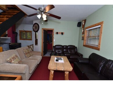 Spacious living room with ceiling fan!