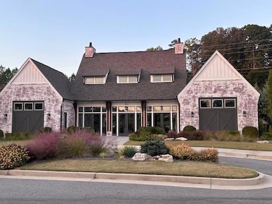 Clubhouse with dining space and kitchen to entertain.  Clubhouse has an outdoor firepit and services the pickle ball courts and pool.