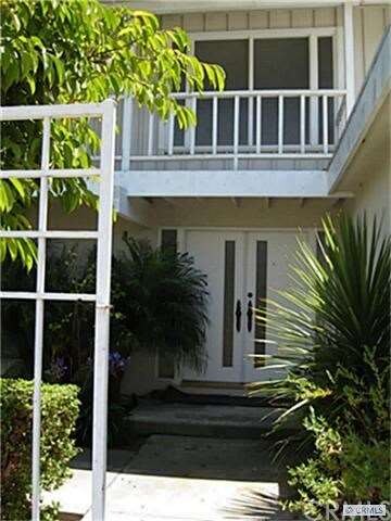 View of front doors from courtyard gate.