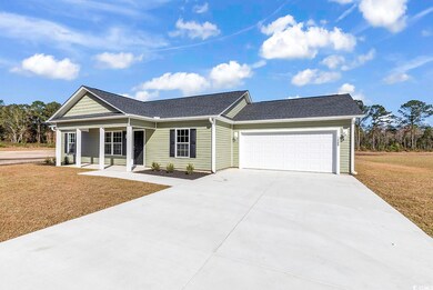 Ranch-style house with a front lawn, covered porch