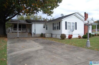 shows the covered deck and second driveway