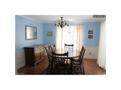 Formal Dining Room with wood floors