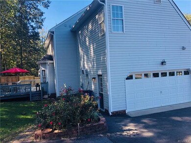 Professionally landscaped! Brick sidewalk leading to pedestrian garage door or large deck! 2-Car Side-Entry Garage!