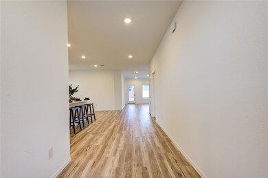 Hall featuring recessed lighting and light wood-t
