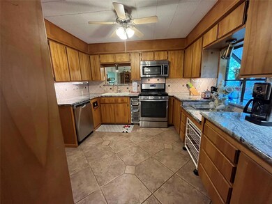 Kitchen featuring appliances with stainless steel 