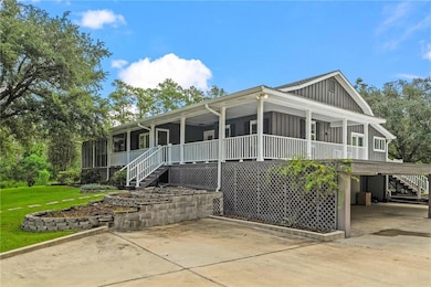 Warp Around Porch with Covered Storage Under Home