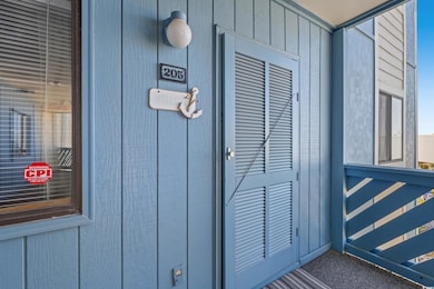 Property entrance with board and batten siding