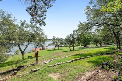 View of yard with a water view