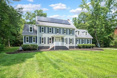 Colonial home featuring crawl space, solar panels,