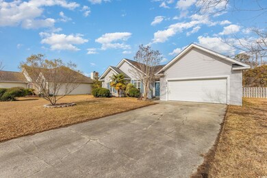 View of front of home featuring a garage and a fro