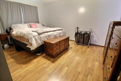 Bedroom with light wood-style floors