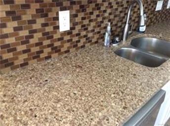 New granite counter tops and stylish tile backspla