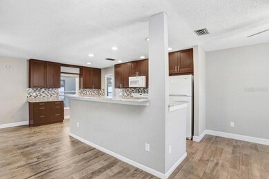 Kitchen with beautiful 42 inch cabinets, granite countertops and beautiful backsplash