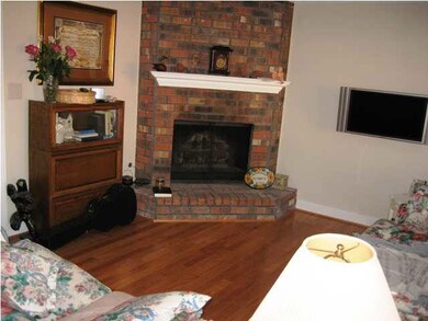Living Room With Hardwood Floors And Fireplace