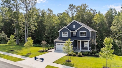 View of front of home featuring a porch, concrete