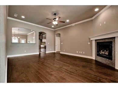 Exterior Front. Living Room with Gas Firplace and Hand Scraped Wood Flooring