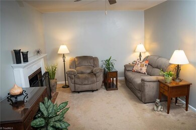 Host Your Guests In Large Living Room With Wood-Burning Fireplace And Ceiling Fan