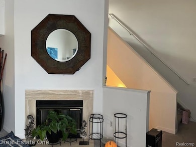 Detailed view of carpet and a fireplace