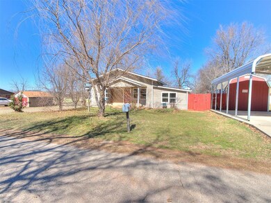 View of front of property featuring fence, a front