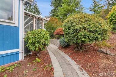 Walk-Way to the Front Porch to the Backyard Covered & Partially Enclosed Deck