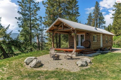 Idyllic off-grid custom built tiny log cabin on 10