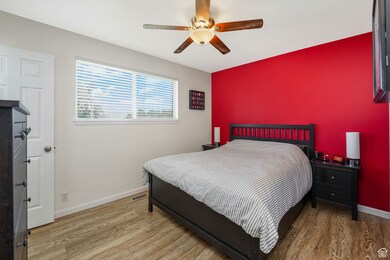 Bedroom featuring light wood-type flooring and ceiling fan