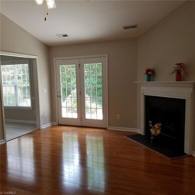 Living Room, entry to breakfast kitchen, doors to patio