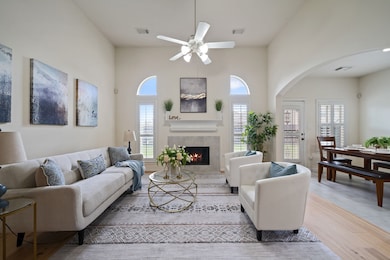 Open concept living room featuring sleek wood floo
