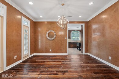 Formal dining room with reclaimed wood flooring an