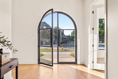 Entryway featuring wood finished floors and baseboards
