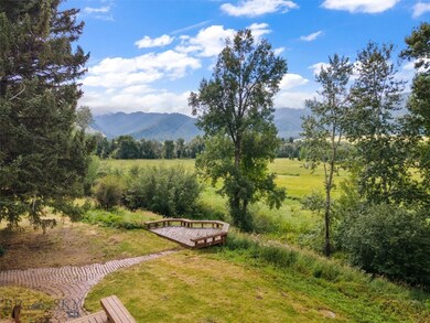 Decks overlooking stream and property.