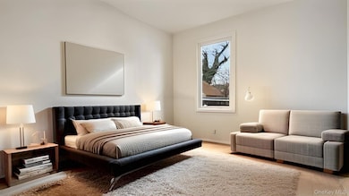 Bedroom with baseboards and wood finished floors