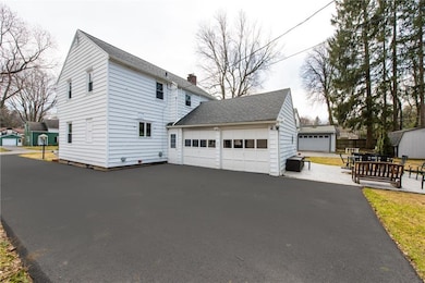 NEW DRIVEWAY OPENS UP TO ATTACHED 2 CAR GARAGE.