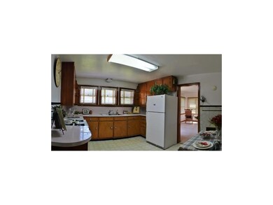 nice eat in kitchen with tons of cabinets. vinyl f