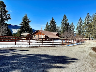 View of stable featuring a mountain view