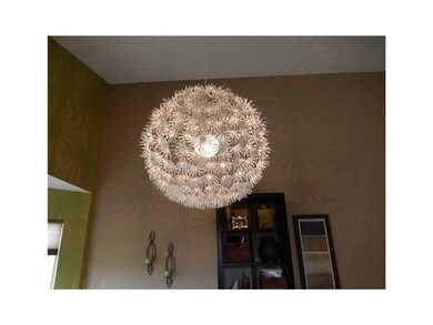 Formal Dining Room. Unique light fixture in dining
