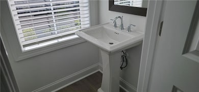 Bathroom with plenty of natural light, wood finish