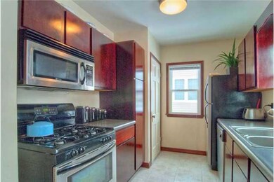 Kitchen. Stainless appliances & dark cabinets in t
