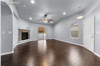Unfurnished living room featuring vaulted ceiling,