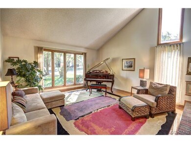 Nice formal living room with hardwood floors, vaul
