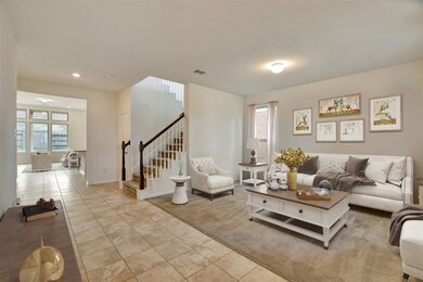 Virtually staged entry way and flex room