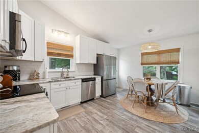 Kitchen featuring appliances with stainless steel