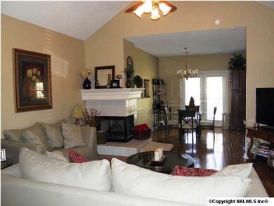 TWO SIDED FIREPLACE WITH HEARTH AND CUSTOM MANTLE.